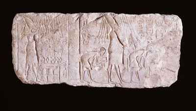 Relief of the heretic King Akhenaten depicting the king standing, arms upraised, before an offering table and walking in procession celebrating the royal heb sed-festival by Egyptian 18th Dynasty